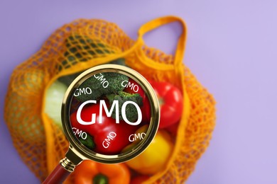 Image of View through magnifying glass on fresh vegetables, top view. GMO concept