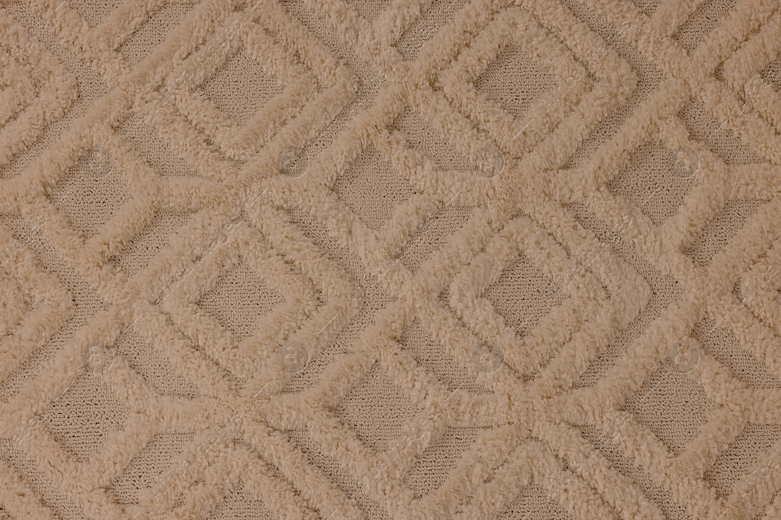 Image of Soft beige carpet with pattern as background, top view