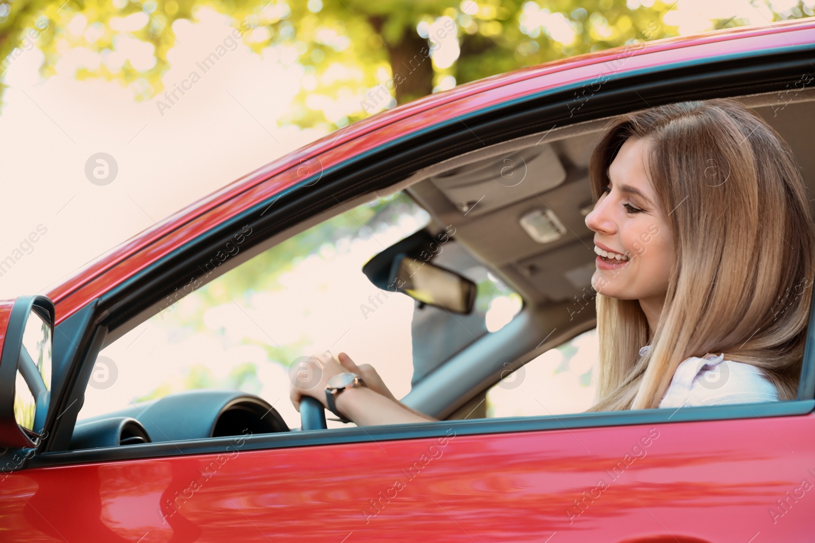 Photo of Happy beautiful woman driving modern car