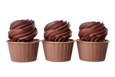 Three delicious chocolate cupcakes isolated on white