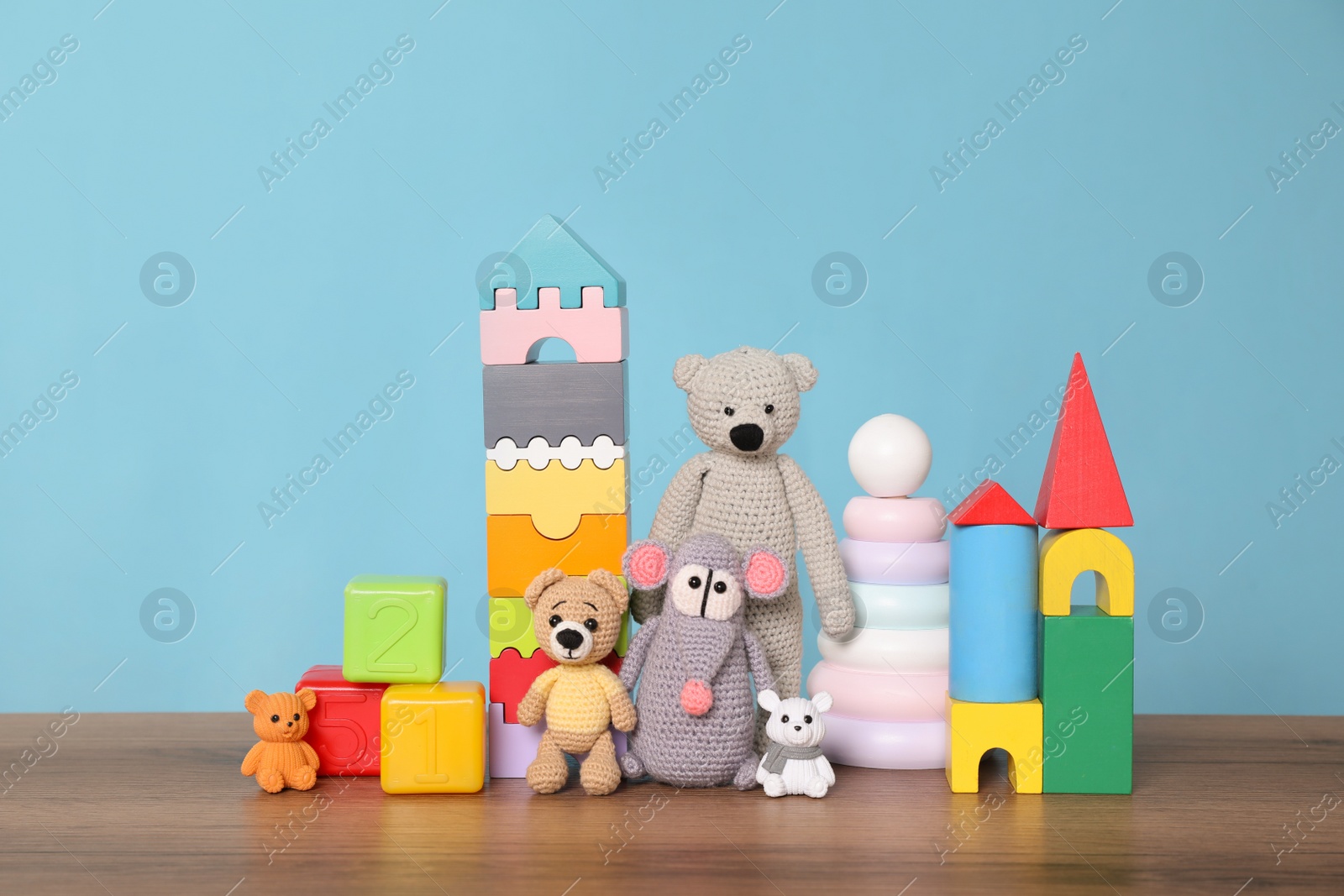 Photo of Collection of different toys on wooden table