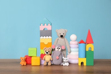 Collection of different toys on wooden table