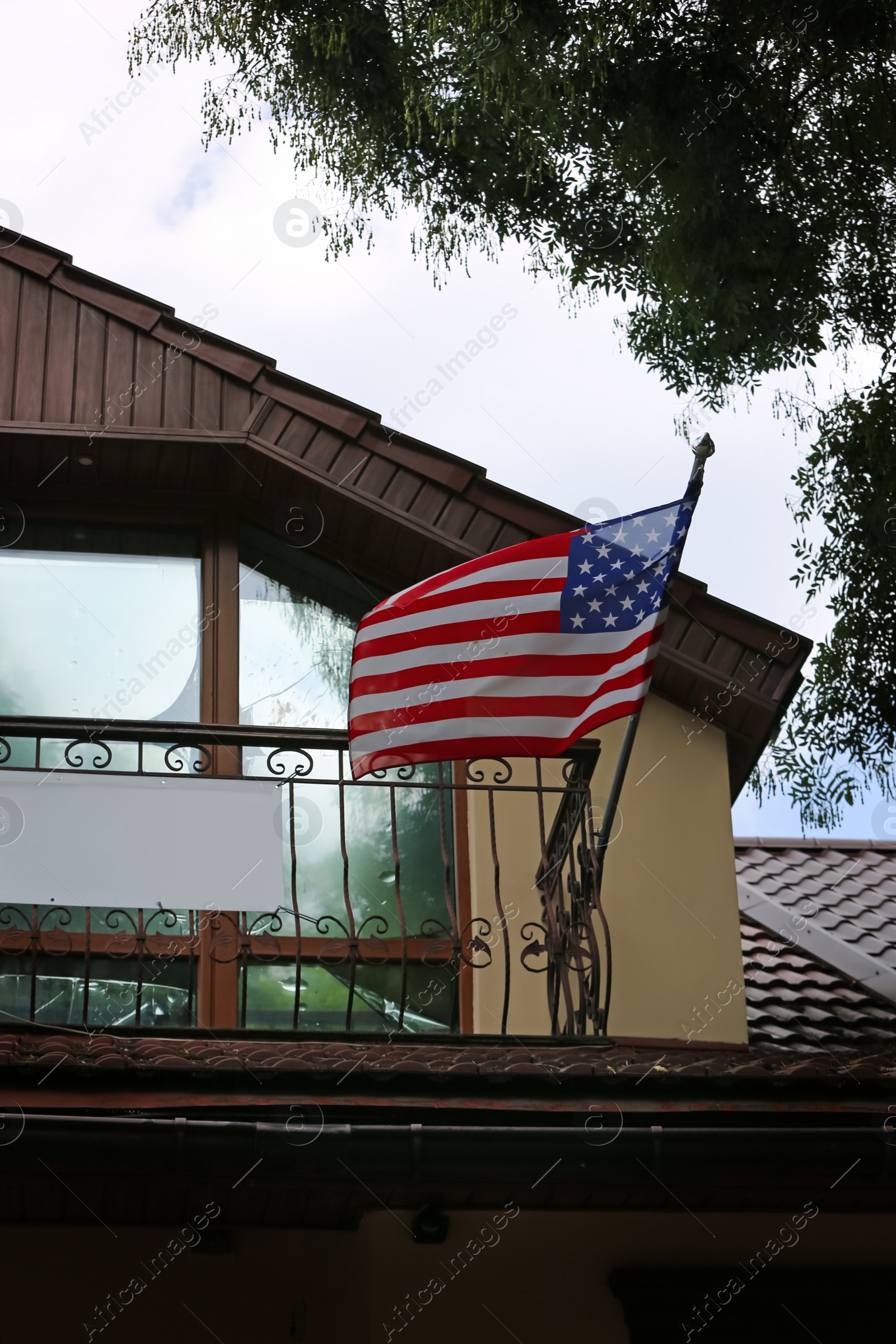 Photo of National flag of USA on building facade