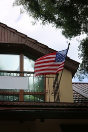 Photo of National flag of USA on building facade