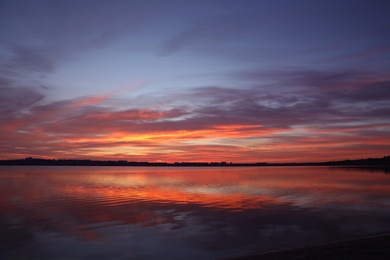 Picturesque view of beautiful sunset over river. Nature healing power