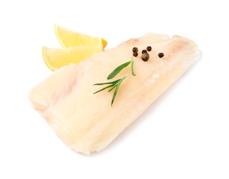 Photo of Pieces of raw cod fish, rosemary, peppercorns and lemon isolated on white