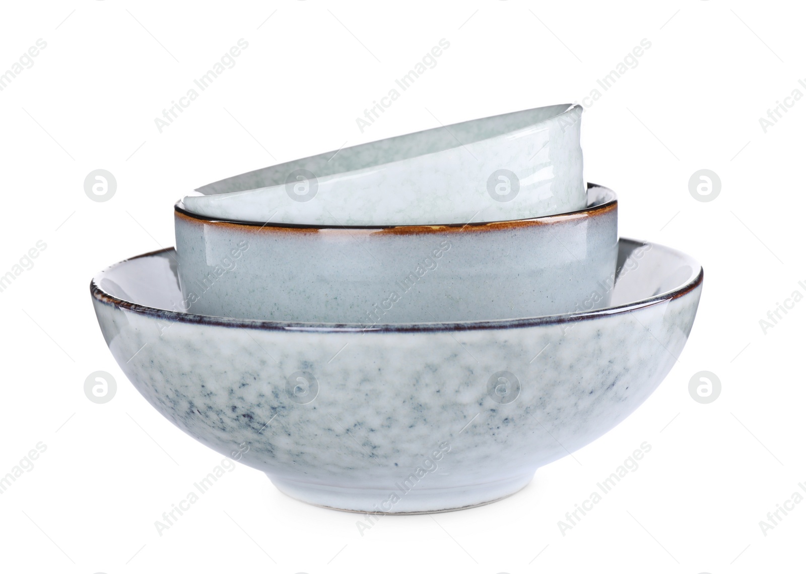 Photo of Stack of ceramic bowls on white background