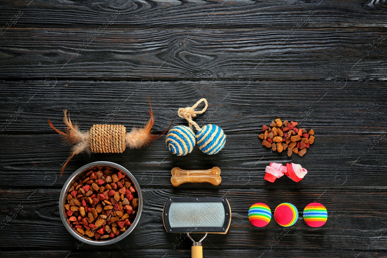 Photo of Cat's accessories and food on wooden background