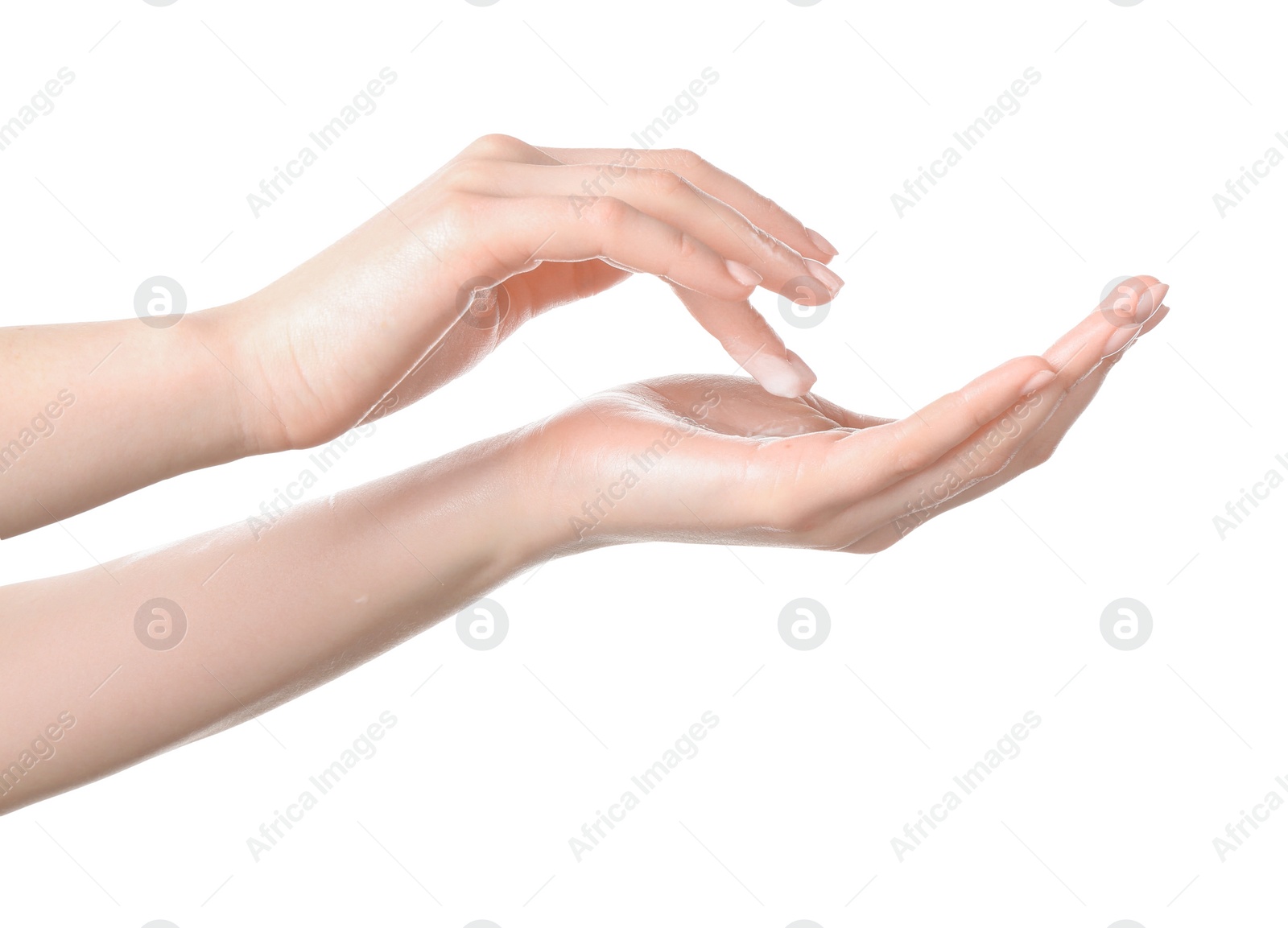 Photo of Woman applying cream on her hand against white background, closeup