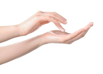 Photo of Woman applying cream on her hand against white background, closeup