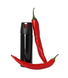 Photo of Bottle of gas pepper spray and fresh chili peppers on white background