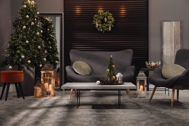 Photo of Elegant living room interior with comfortable sofa and Christmas decor