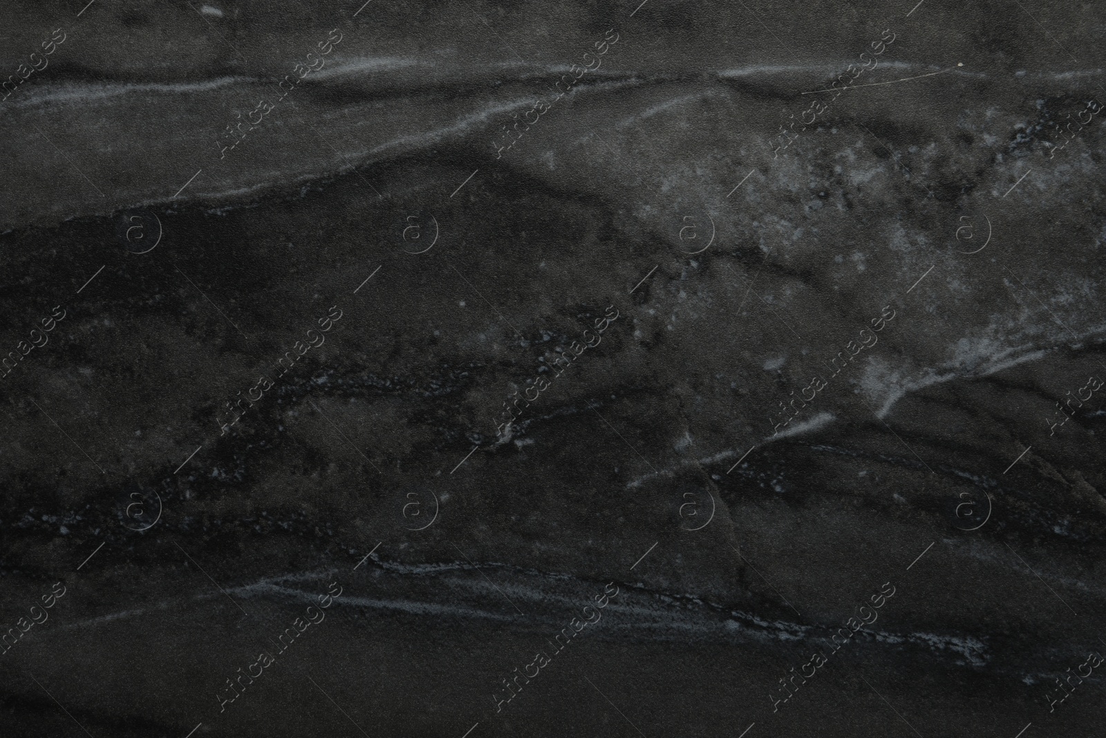 Photo of Black marble surface as background, closeup view