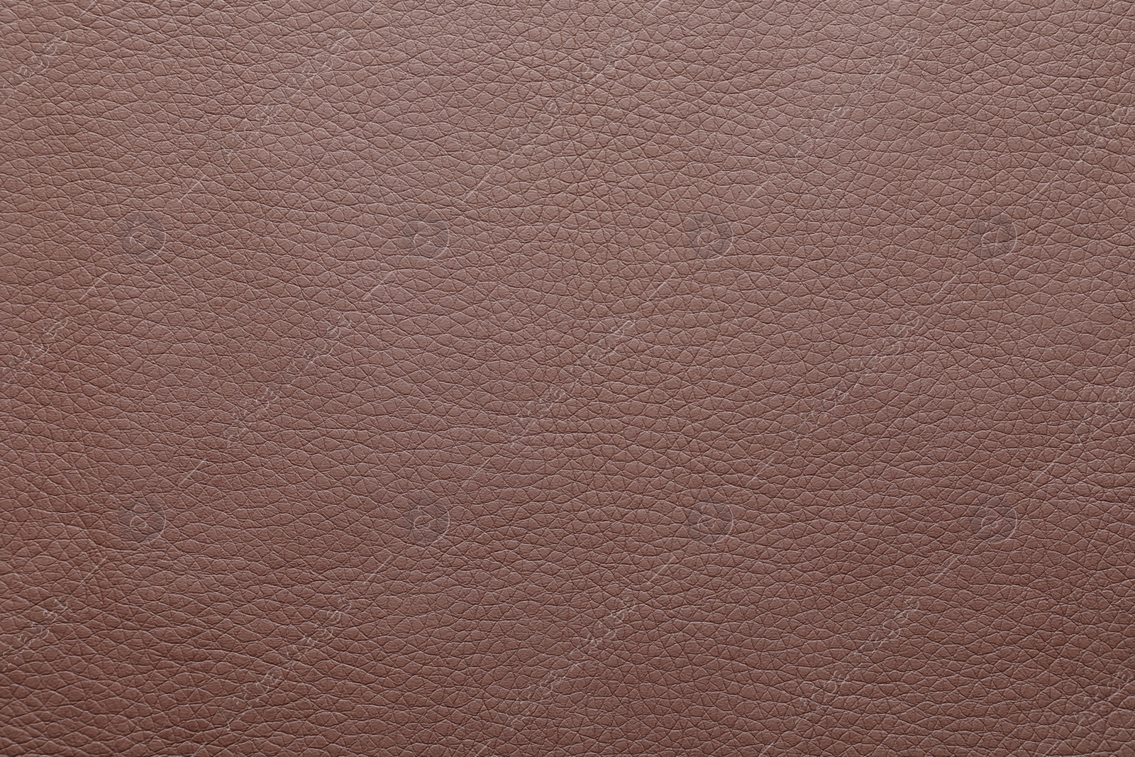 Photo of Texture of brown leather as background, closeup