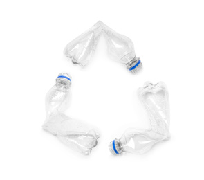 Photo of Empty crumpled bottles isolated on white, top view. Plastic recycling