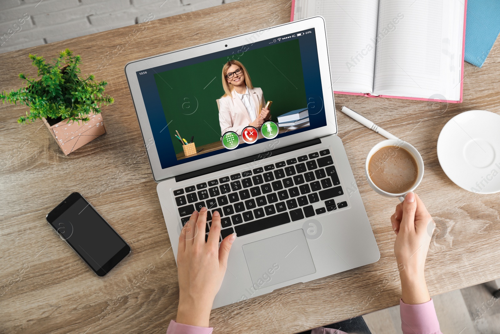 Image of Distance learning, online school lesson. Girl studying at home during quarantine and lockdown due to Covid-19 pandemic, top view