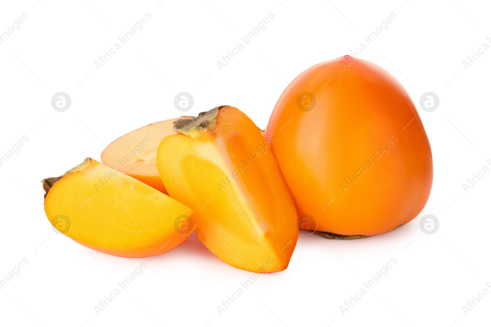 Photo of Whole and cut delicious ripe juicy persimmons on white background