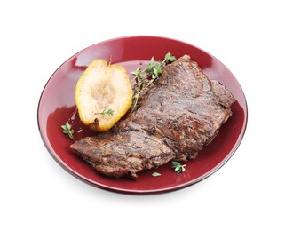 Delicious roasted beef meat, caramelized pear and thyme isolated on white