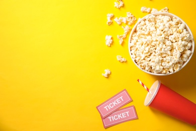 Photo of Flat lay composition with popcorn and space for text on color background. Cinema snack