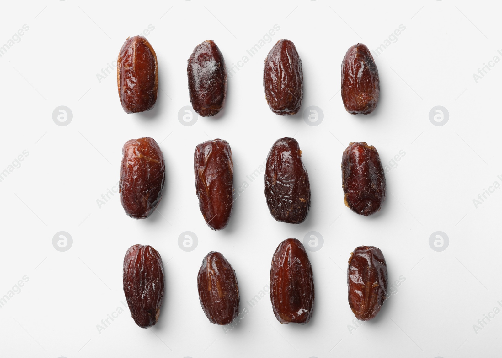 Photo of Sweet dates on white background, top view. Dried fruit as healthy snack