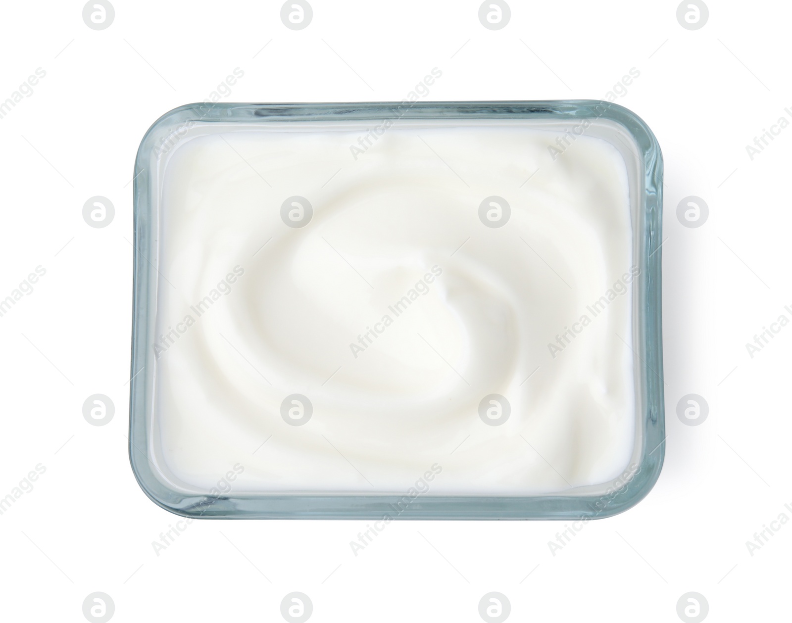 Photo of Delicious natural yogurt in glass bowl isolated on white, top view