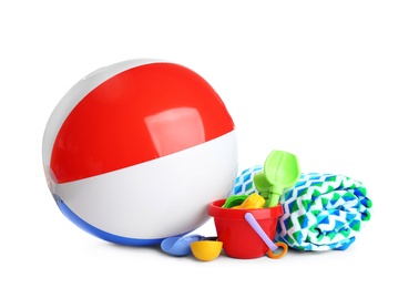 Photo of Beach ball, towel and set of plastic toys on white background