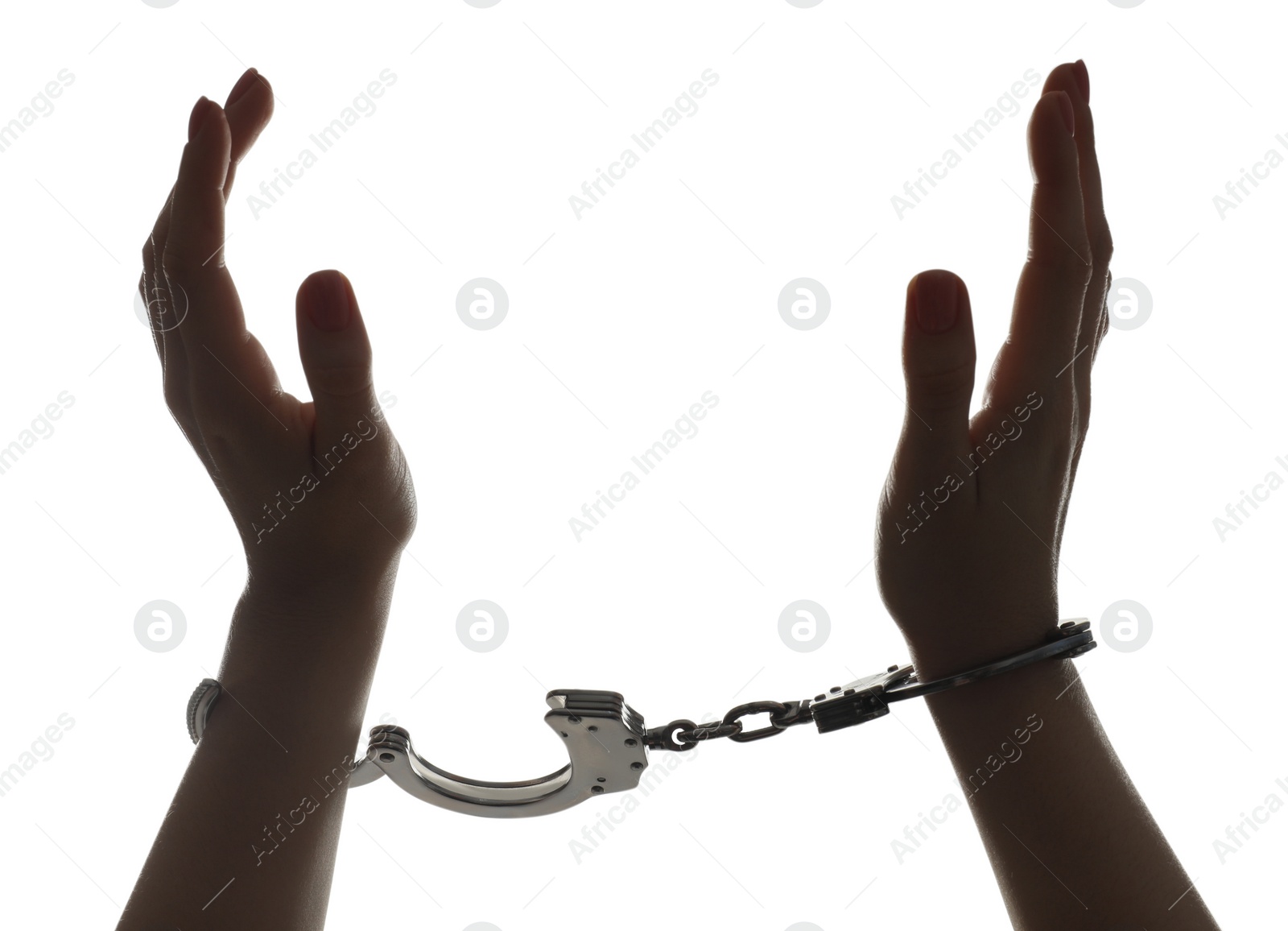 Photo of Freedom concept. Woman with handcuffs on white background, closeup