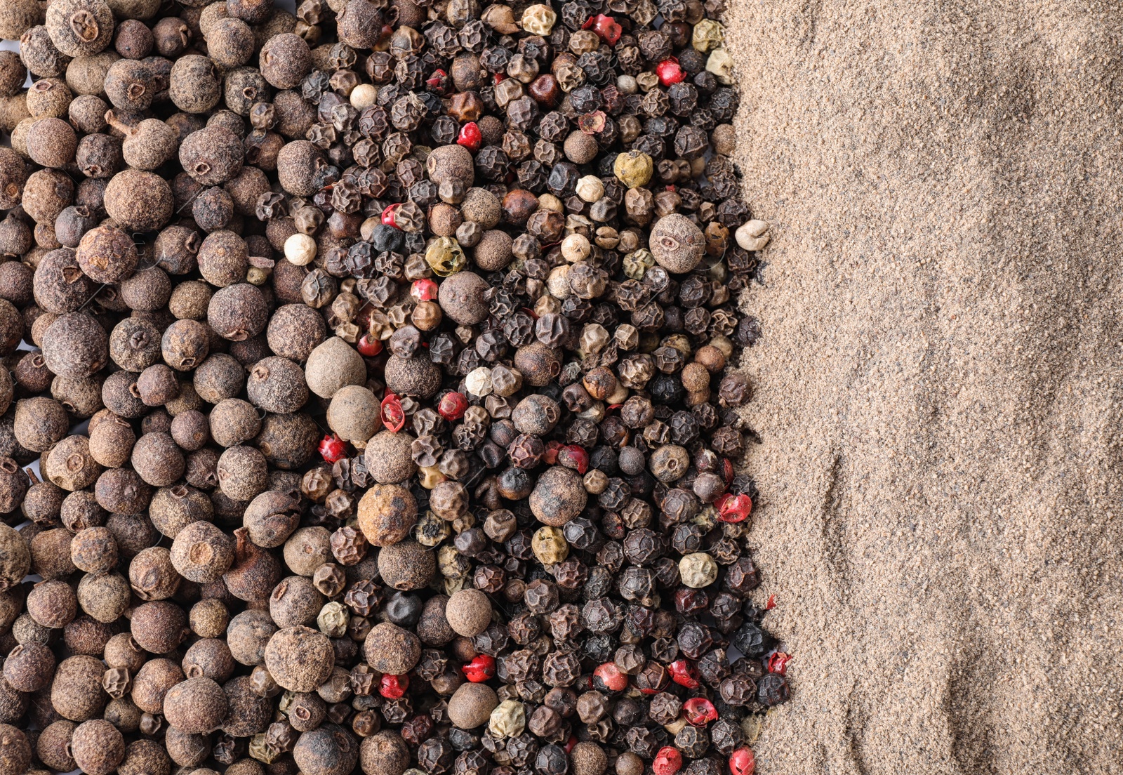 Photo of Different spicy peppers as background, top view