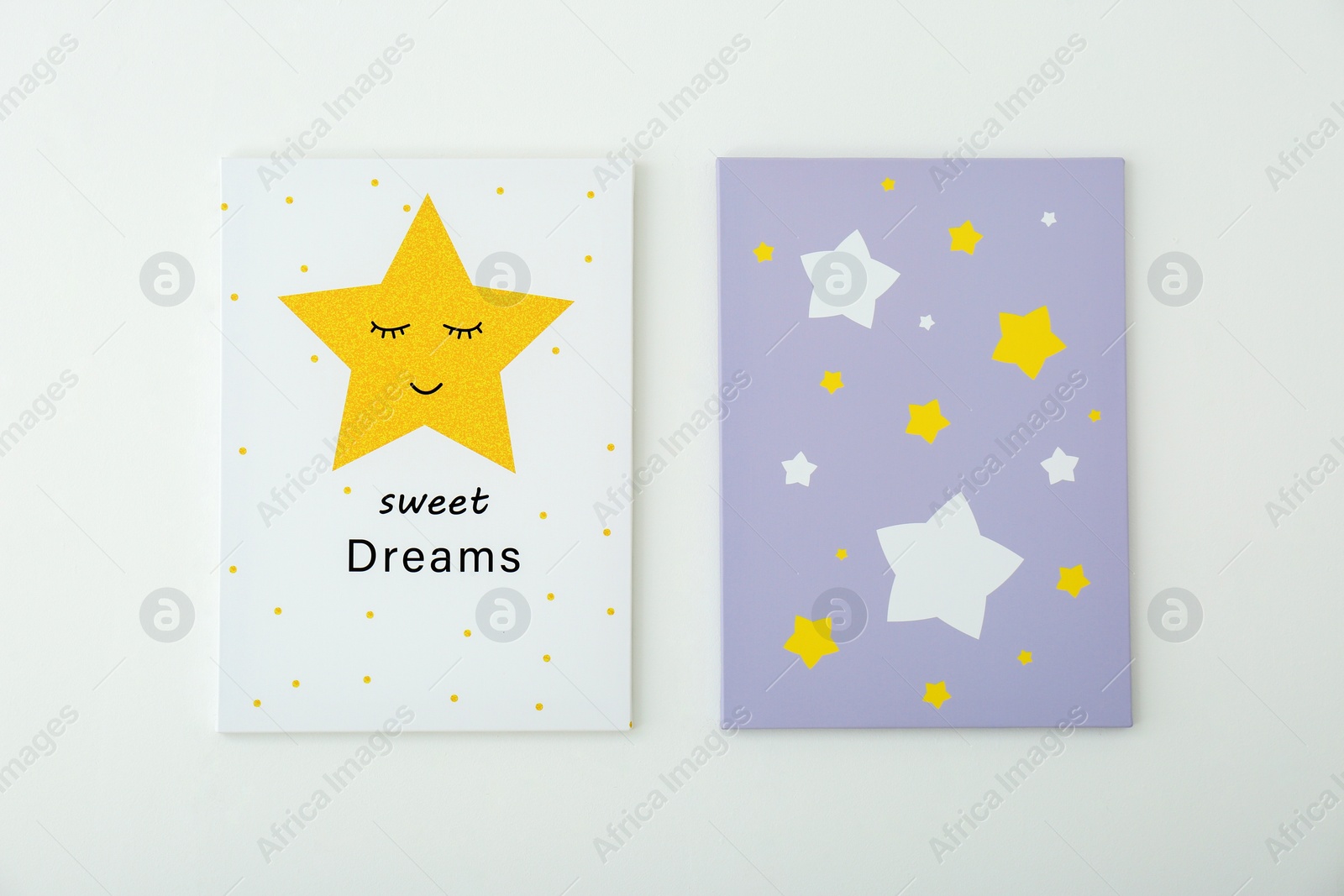 Photo of Adorable pictures of stars with words SWEET DREAMS on white wall. Children's room interior elements