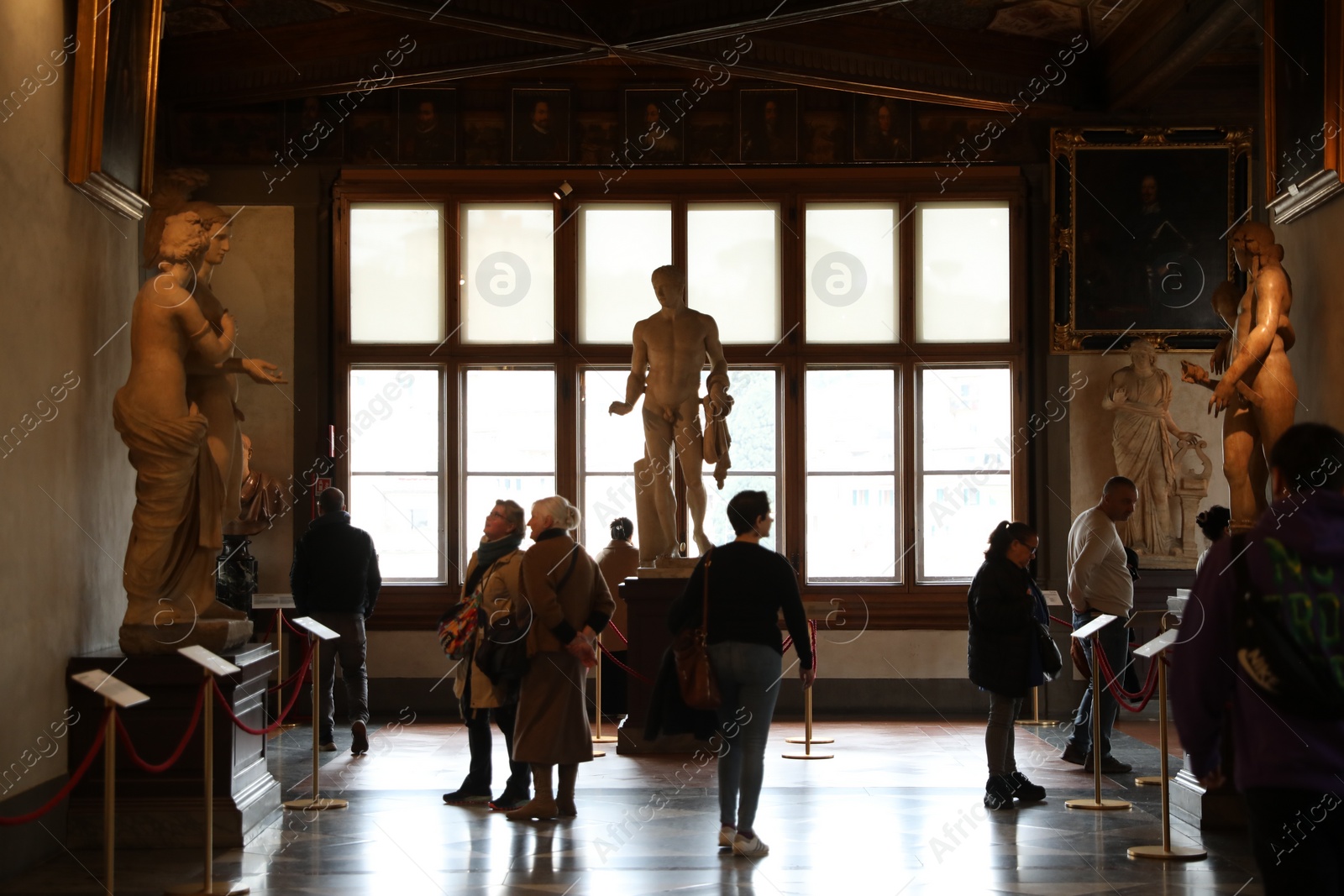 Photo of Florence, Italy - February 8, 2024: Visitors admiring different famous sculptures at Uffizi gallery