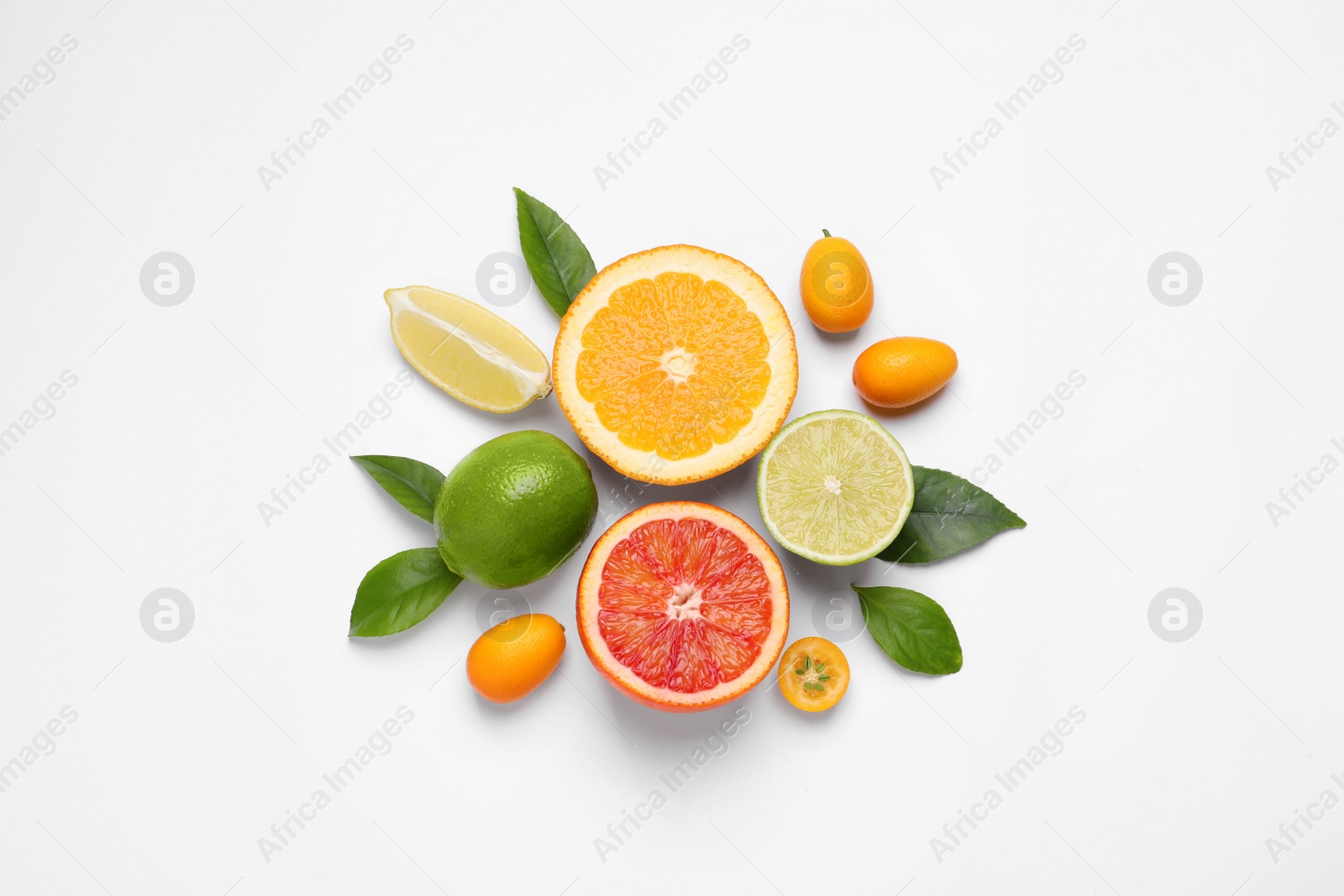 Photo of Fresh juicy citrus fruits with green leaves on light background, flat lay