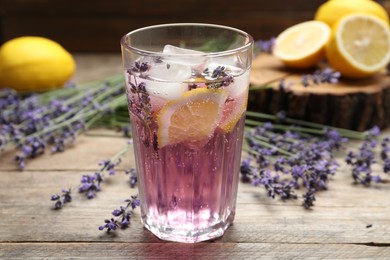 Photo of Fresh delicious lemonade with lavender on wooden table