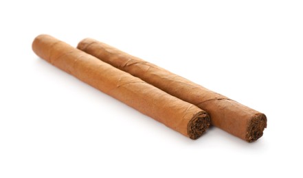 Cigars wrapped in tobacco leaves on white background