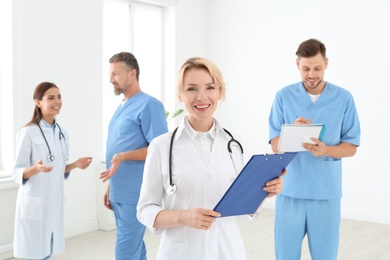 Doctors and medical assistants in clinic. Health care service