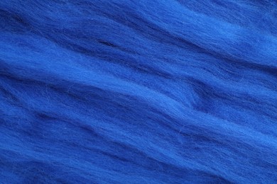 Photo of Blue felting wool as background, closeup view