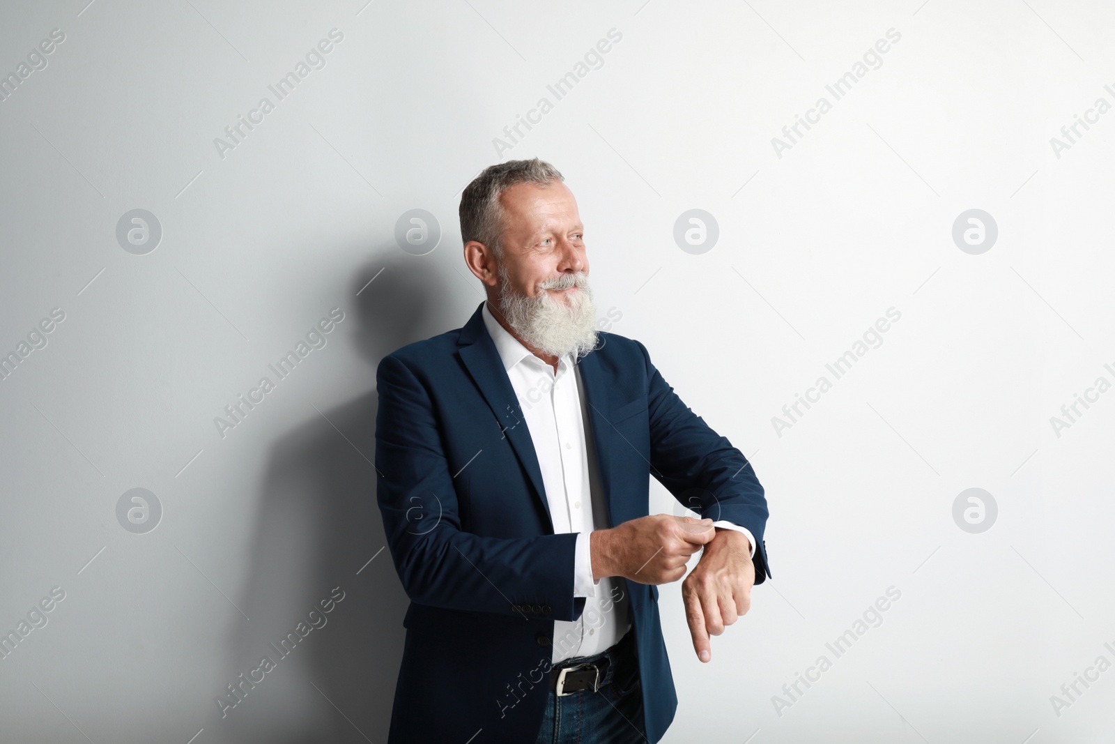 Photo of Portrait of handsome senior man on white background