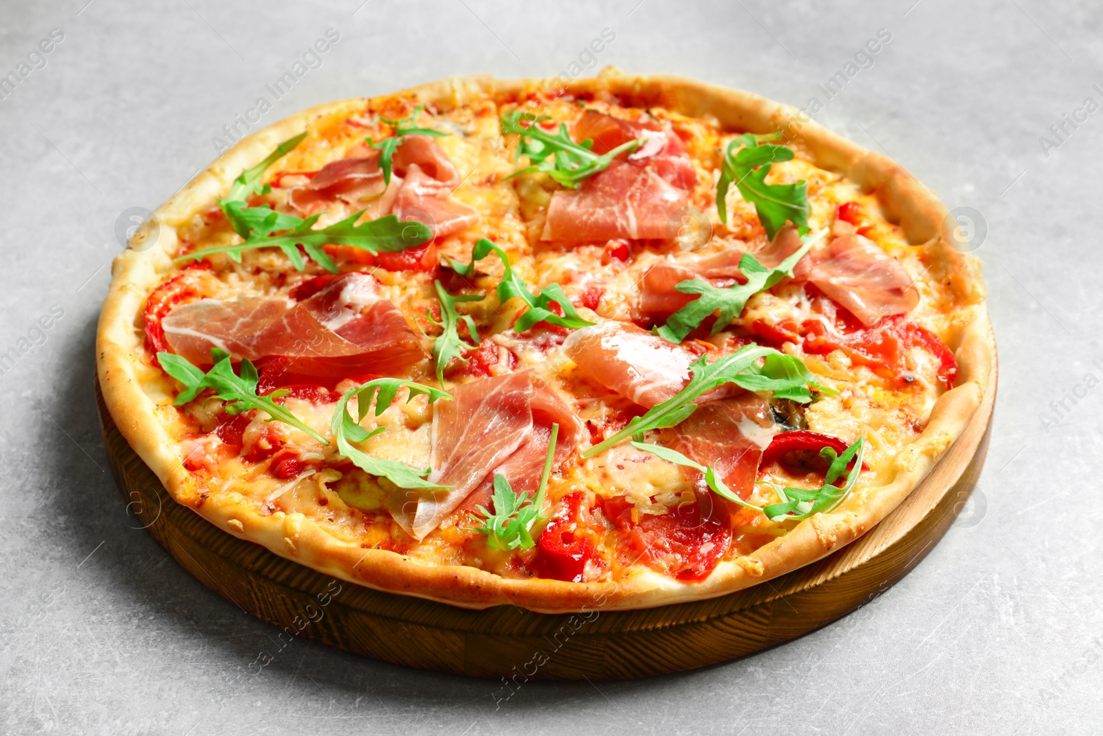 Photo of Tasty hot pizza with meat on light background