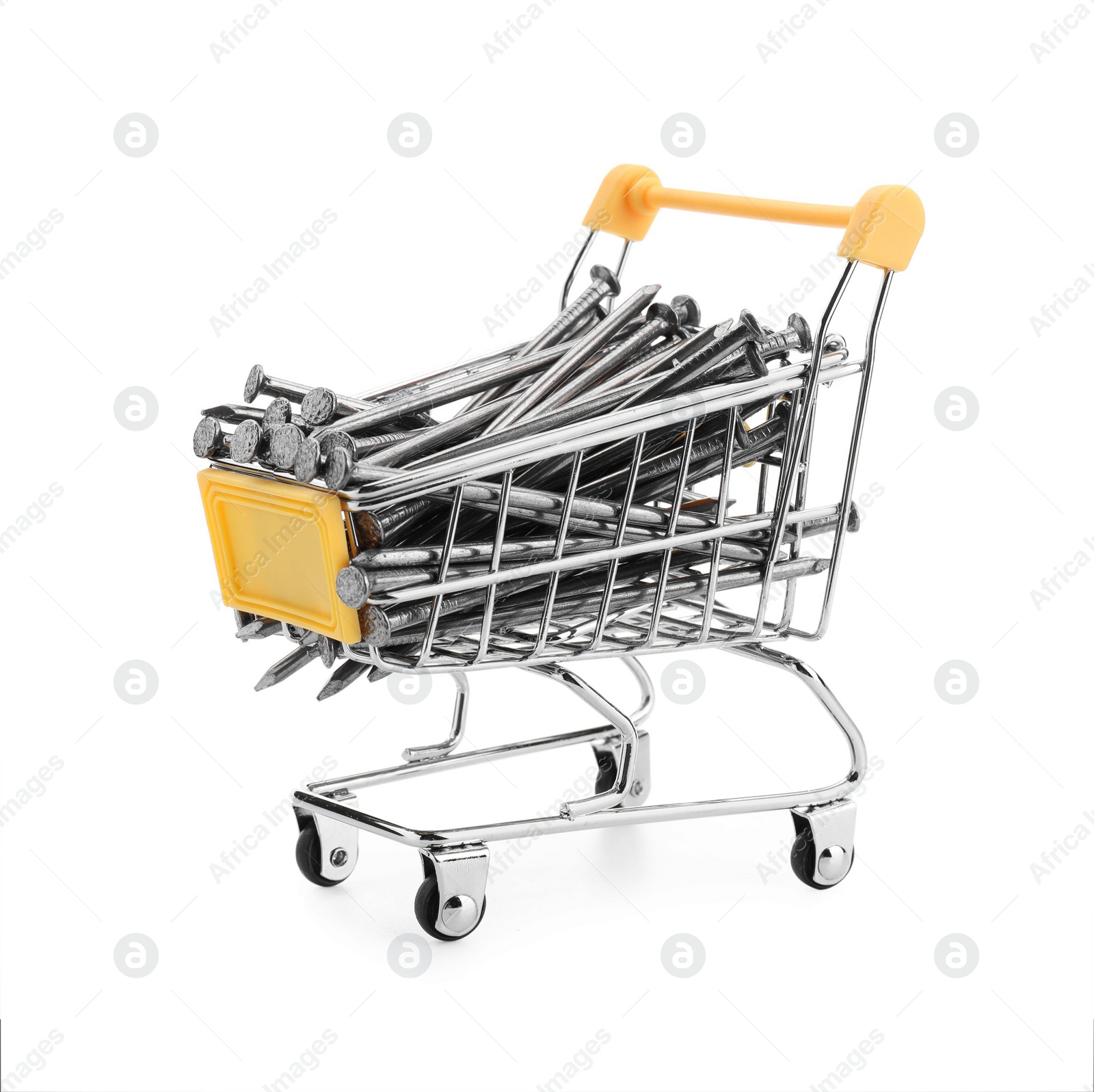 Photo of Metal nails in shopping cart isolated on white