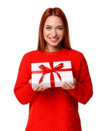 Photo of Young woman in red sweater with gift box on white background. Christmas celebration