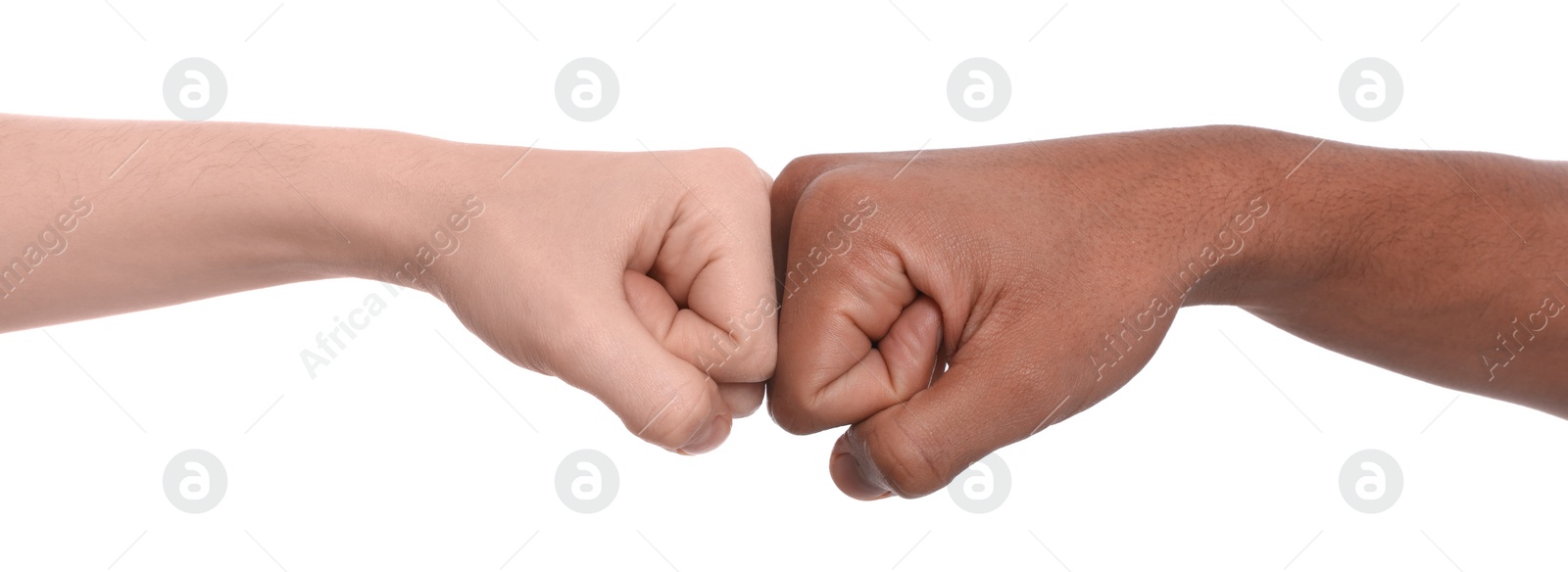 Photo of International relationships. People making fist bump on white background, closeup