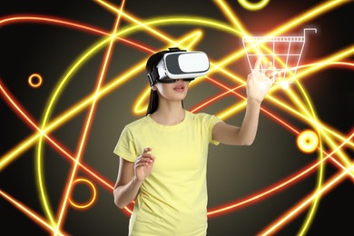 Virtual shopping. Woman using VR headset on color background