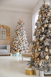 Photo of Beautiful interior of living room with decorated Christmas trees