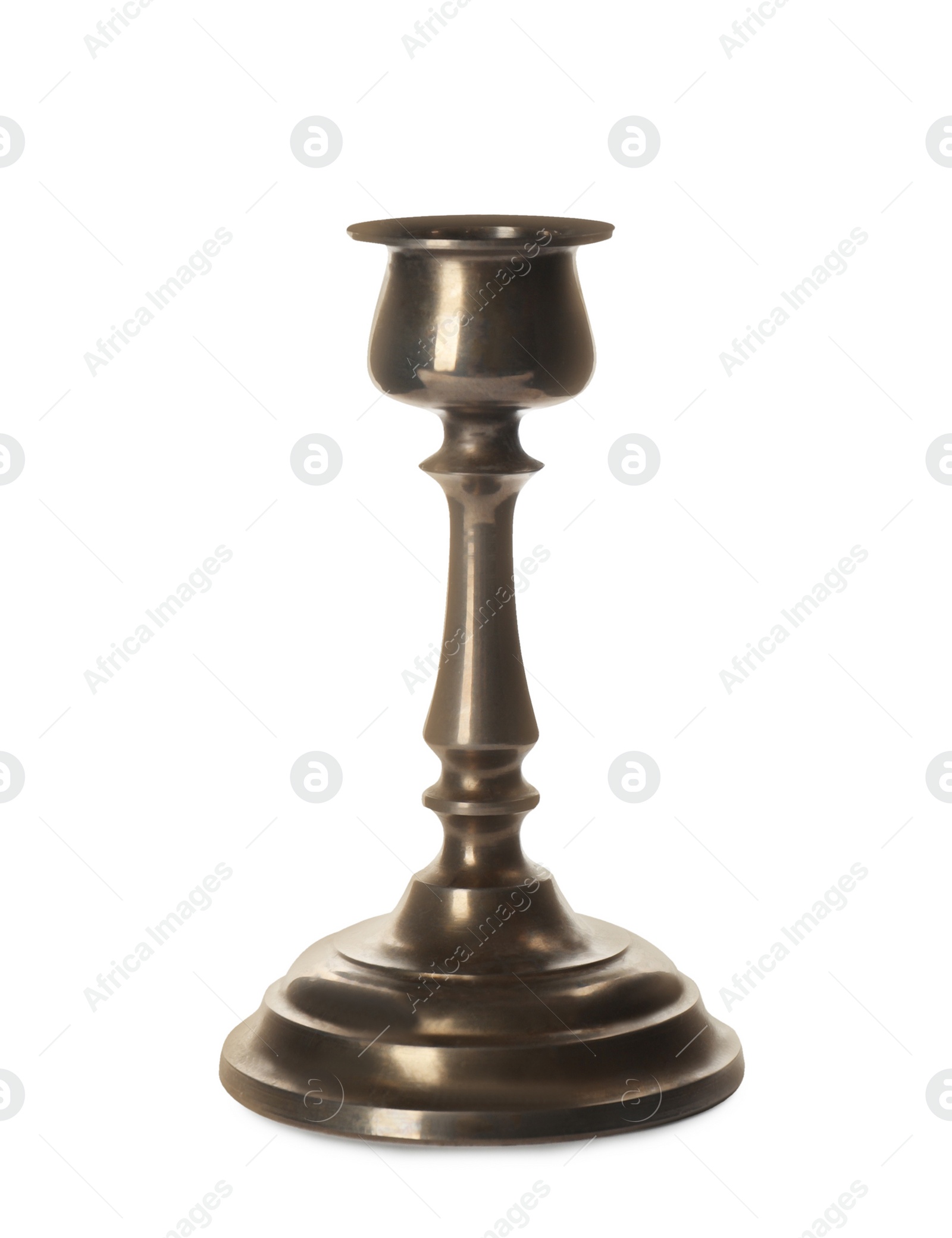 Photo of One vintage metal candlestick isolated on white