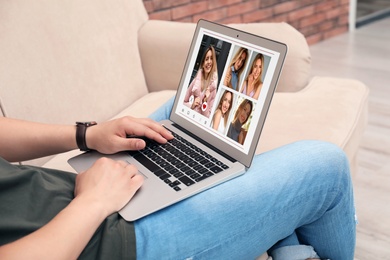 Image of Man visiting dating site via laptop indoors, closeup