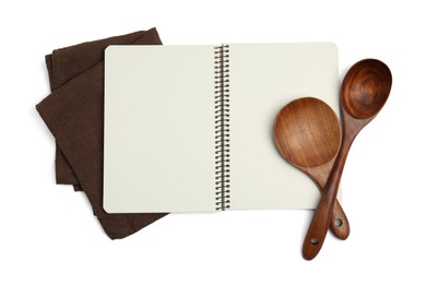 Blank recipe book, napkin and wooden utensils on white background, top view. Space for text