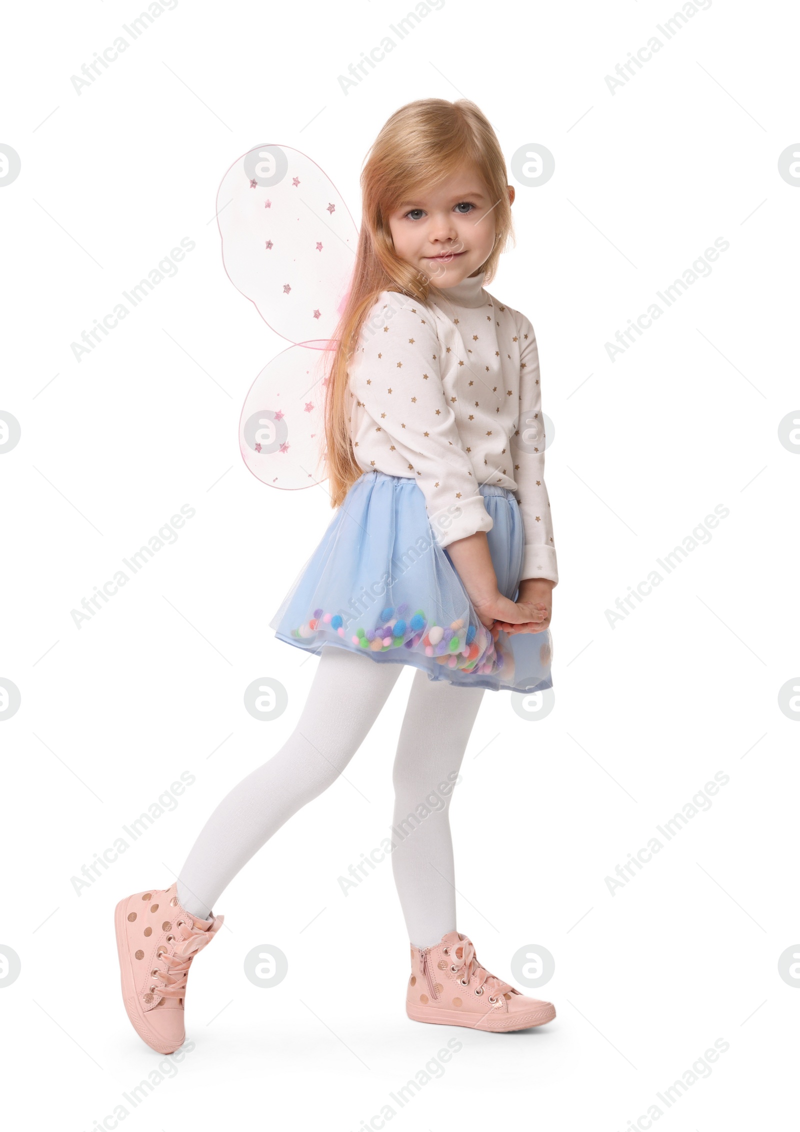 Photo of Cute little girl in fairy costume with pink wings on white background