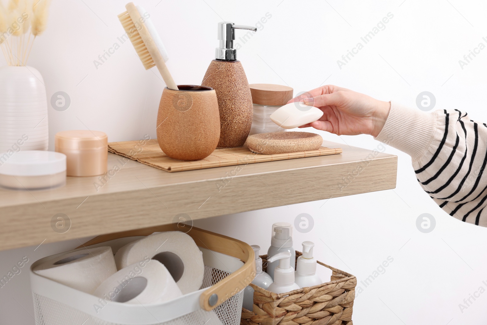 Photo of Bath accessories. Woman with soap indoors, closeup