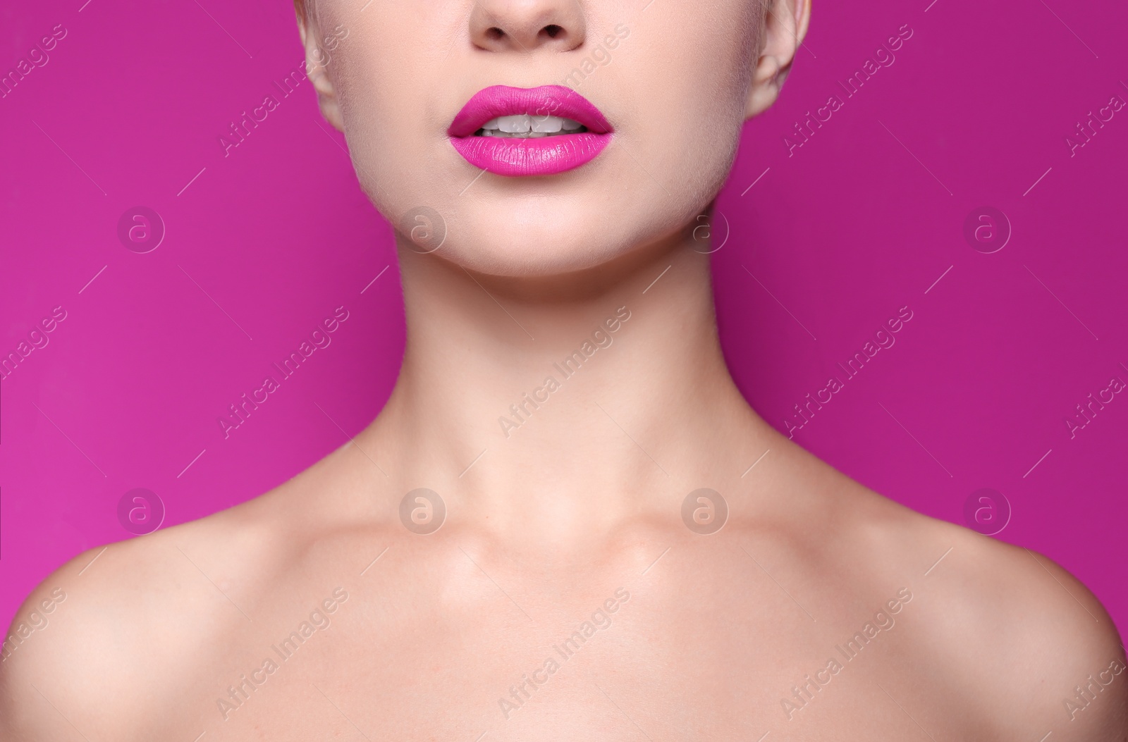 Photo of Beautiful young woman with perfect lips makeup on color background, closeup