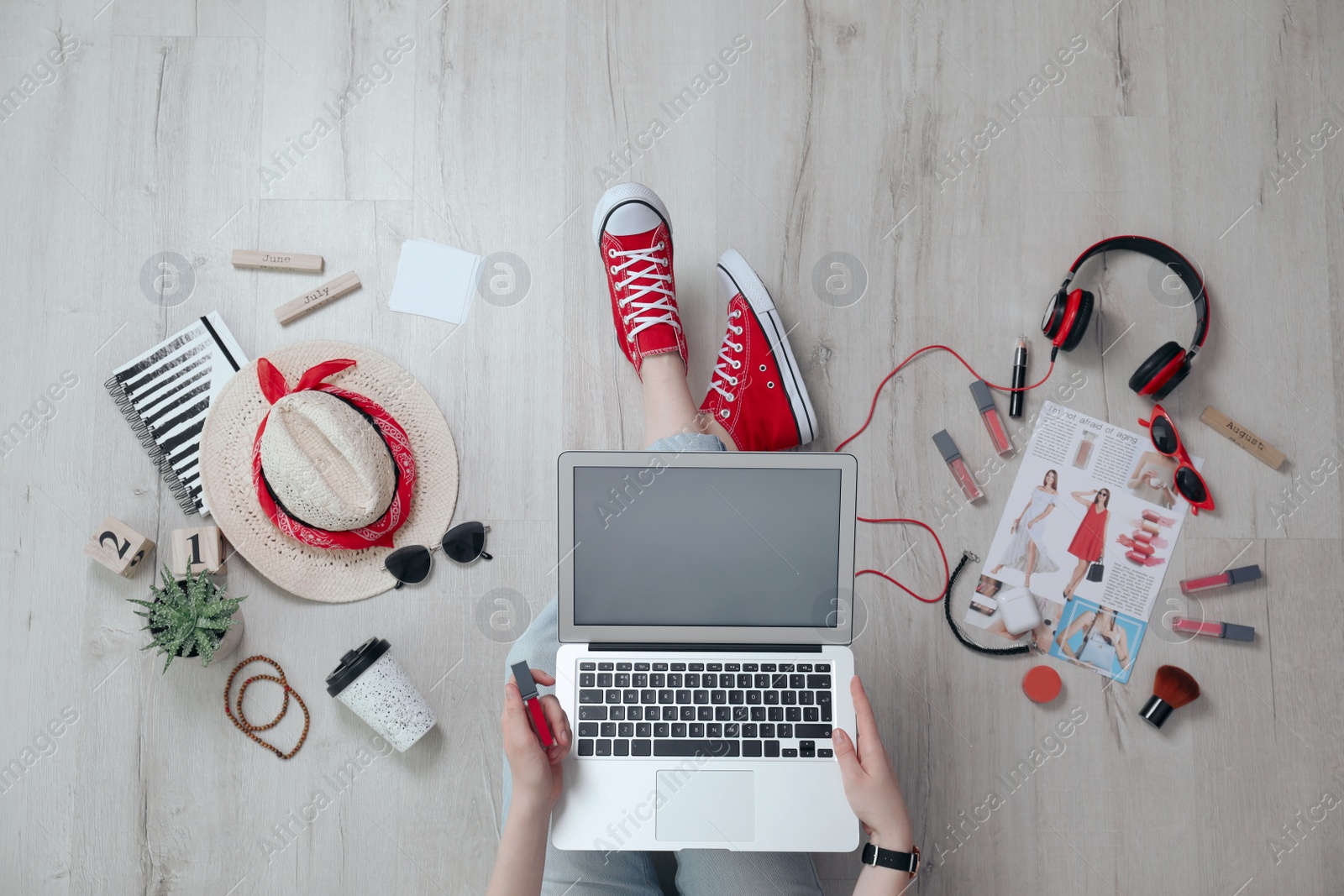 Photo of Fashion blogger with laptop on floor, top view