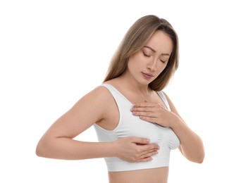 Mammology. Young woman doing breast self-examination on white background